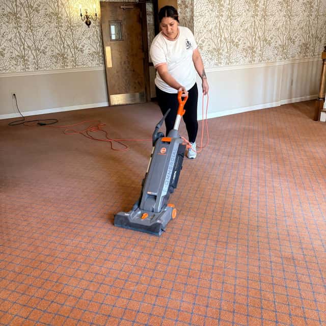 Vacuuming a large carpeted function room — MARTS-R.P Cleaning Solutions LLC