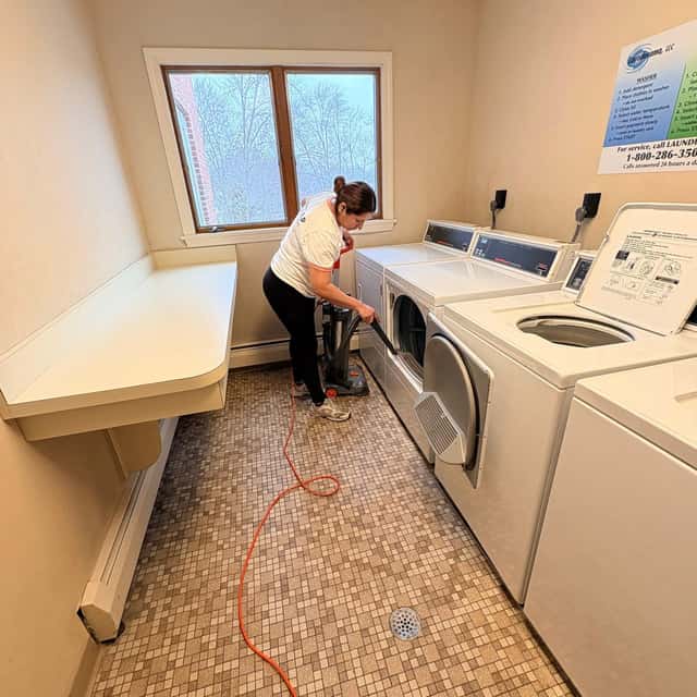 Cleaning the tops of the dryers in a laundry room — MARTS-R.P Cleaning Solutions LLC